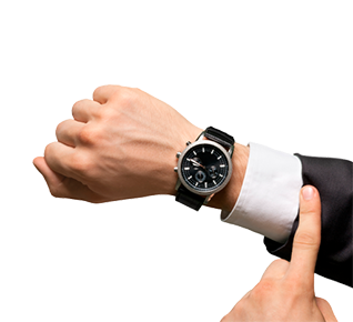 Person's wrist wearing a black strap luxury watch